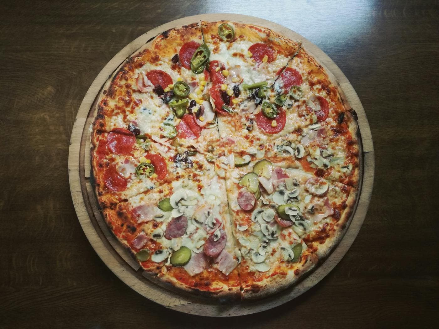 Whole 14-inch specialty pizza baked in store at Gobbler's Market